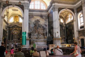 Venice, Italy - August 13, 2016: People inside of Saint Moses church (Basilica di San Moise)