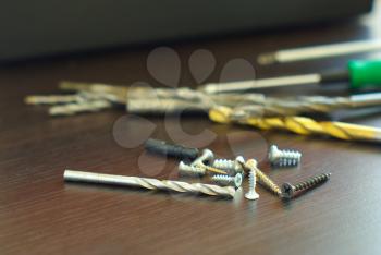 Drill with metal screws home repair components. Furniture mounting master set. Drilling installation equipment. 