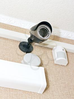 Royalty Free Photo of a CCTV Camera and Sensor on the Wall