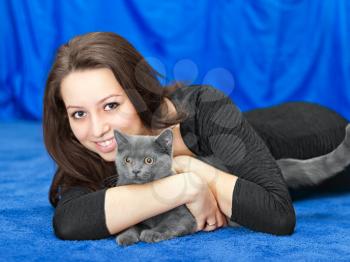 beautiful girl with a cat on hands