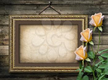 Royalty Free Photo of a Vintage Frame on Wood With Roses