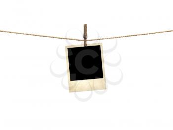 Royalty Free Photo of a Polaroid Hanging on a Line