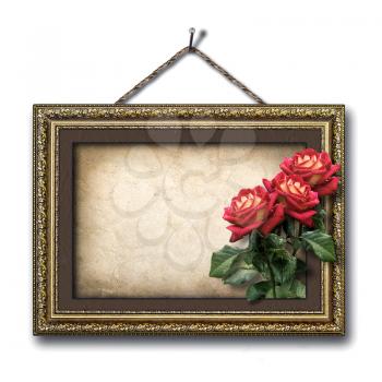 Vintage picture frame and a bouquet of red roses
