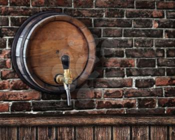 wooden bar counter with a beer barrel on a brick wall in the background