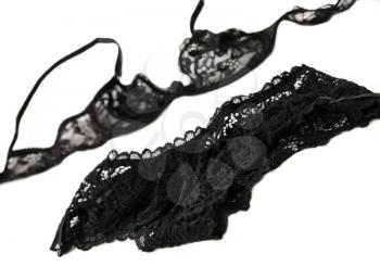 A set of black lacy women's underwear on a white background