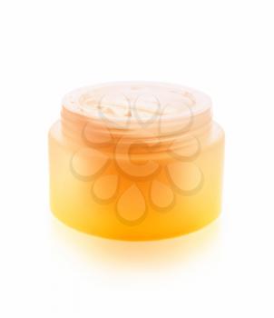 Cream for skin care in a saturated jar isolated on a white background