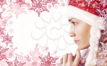 White background with a girl in Santa hat and a snowflake