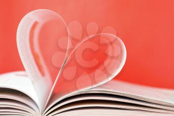 Royalty Free Photo of a Heart Shape in a Book
