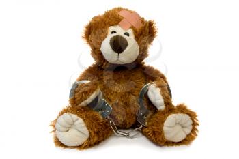 Royalty Free Photo of a Handcuffed Teddy Bear