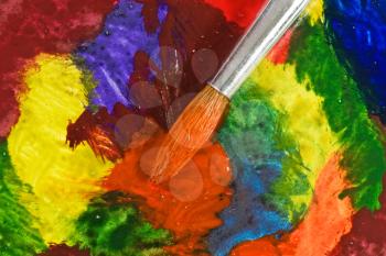 Royalty Free Photo of a Paintbrush on a Painting