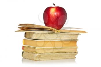Red apple and stack of books with reflection on white background