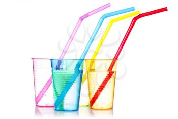 Four colorful drinks with straws, isolated on white background