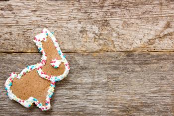 Homemade gingerbread bunny on the wooden background