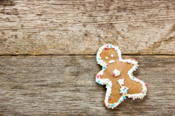 Homemade gingerbread man  on the wooden background