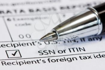 Close-up pen on the US tax form 