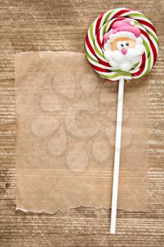 Blank paper and Christmas candy with Santa face