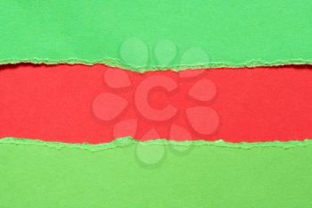 Torn green paper with a red background for your text.