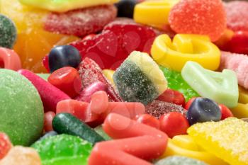 Colorful candies, jellies, lollipops and marmalade. Close-up view