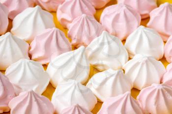 Close Up of mini white and pink meringues