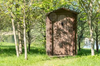 Wooden outhouse for tourists at a forest