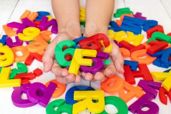 Child learning  using magnetic letters. Education School Concept