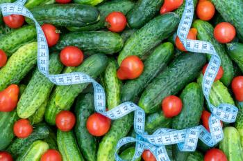 Measuring tape and fresh vegetable, dieting concept