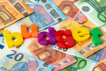 Euro currency and word BUDGET made from colored plastic letters