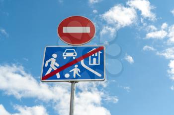 Road sign  of the living area on sky background