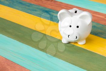  Piggy bank on color wooden background,financial investment or saving concept