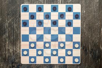 Checkers in checkerboard redy for playing. Game concept. Board game.