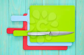 Set of cutting boards with a kitchen knife.Top view.