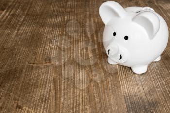 Piggy bank on wood table, business and finance concep