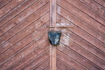 Locked old wooden garage door. Close-up view