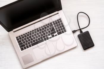 Data transfer from laptop computer to external hard disk for backup files and important information using USB 3.0 connection
