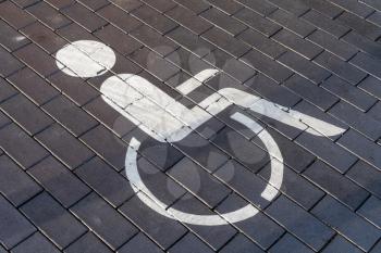 Disabled Person Wheelchair Sign Traffic Symbol On Brick Stone Pavement