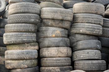 Used car tires pile in the tire repair shop yard