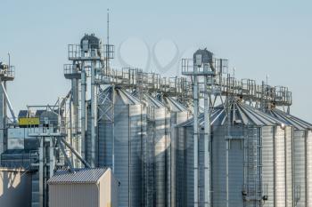 Modern storage technology agro-industry, metal containers for grain business granary trail perspective
