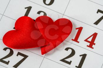 Valentine's day, February 14 on the calendar with red hearts 