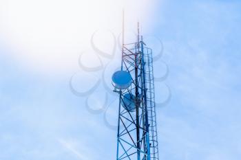 Network telecommunication equipment with radio modules and smart antennas mounted on a metal tower.
