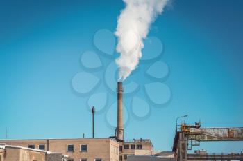 The plant emits smoke and smog from the pipe.Atmospheric Air Pollution From Industrial Smoke.