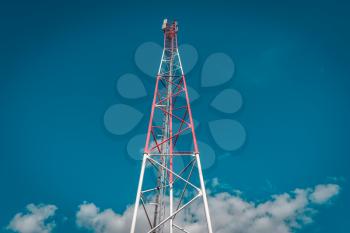 Low angle view of telecommunication tower against sky background