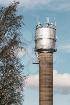 Tall water tower with 4G communication antennas