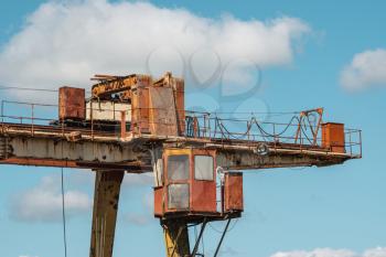 Very old industrial crane in an abandoned factory