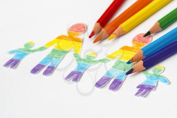 Paper family colored in LGBT rainbow colors. The concept of lgbt friendly and tolerance