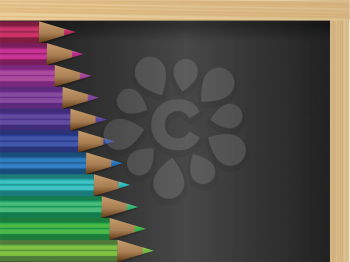 Royalty Free Clipart Image of Pencil Crayons on a Blackboard