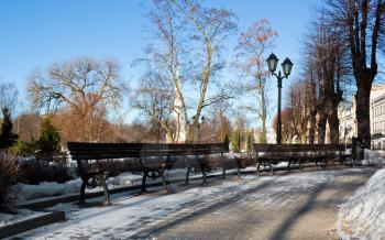 Bench in winter park of Riga
