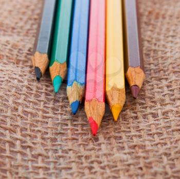 Colourful pencils on the sack material