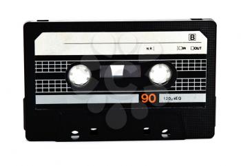 Old black audio casette on white background