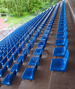 Blue plastic chairs on the stadium