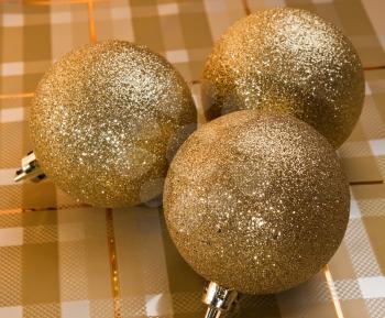 Three golden holliday  decorative balls